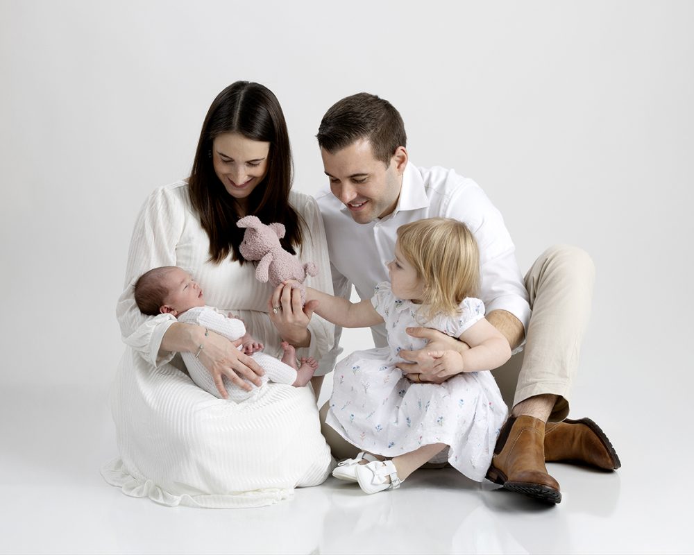 newborn family photographer sudbury ma sibling introducing baby