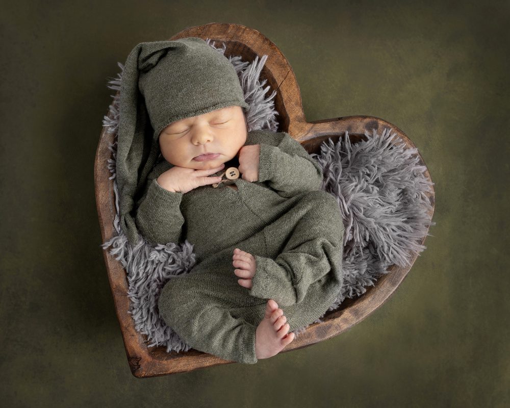 Sleeping newborn portrait photographed in a professional newborn studio near Framingham, Massachusetts.