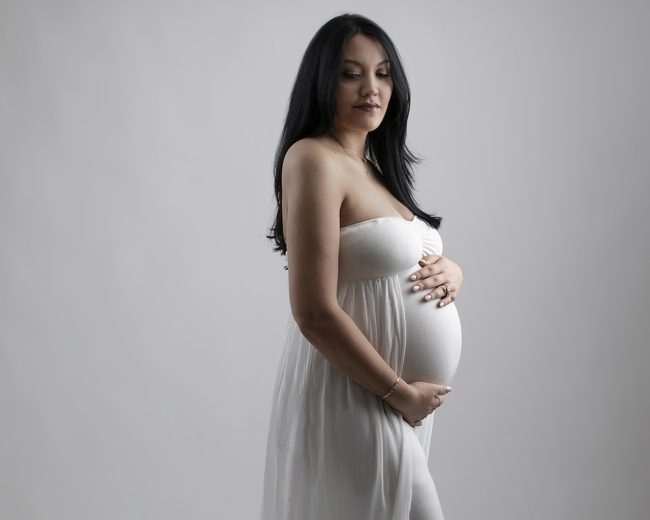 Studio maternity portrait photographed in Sudbury, Massachusetts by Paula Swift Photography