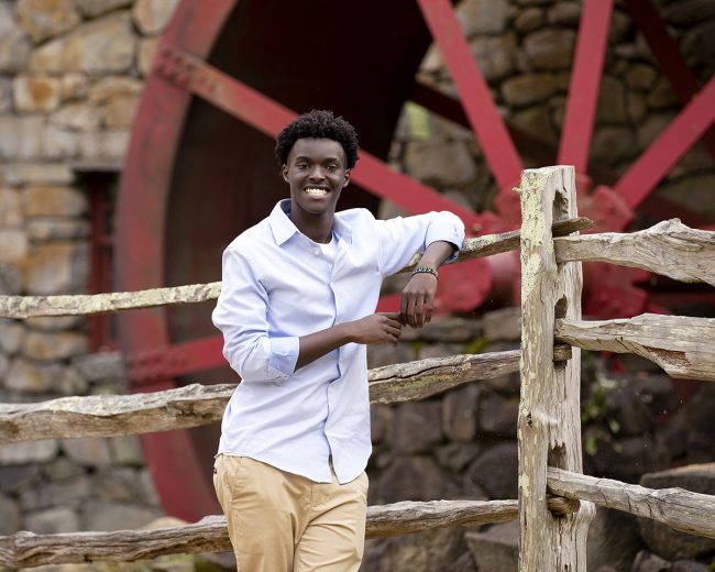 High school senior portrait photographed at the Wayside Inn Grist Mill in Sudbury, Massachusetts by Paula Swift Photography